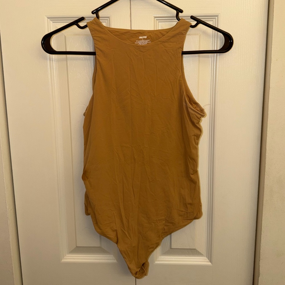 SKIMS Sleeveless High-Neck Bodysuit in Mustard
